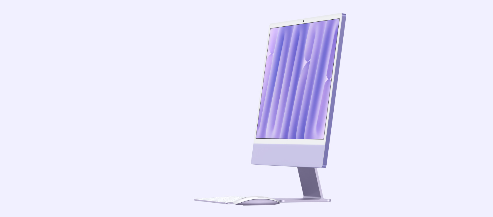 iMac morada con teclado y mouse
